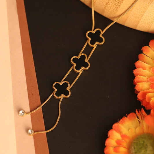 Noir Bloom Trinity Lariat – Gold-Plated Black Clover Necklace - ZIPPORY