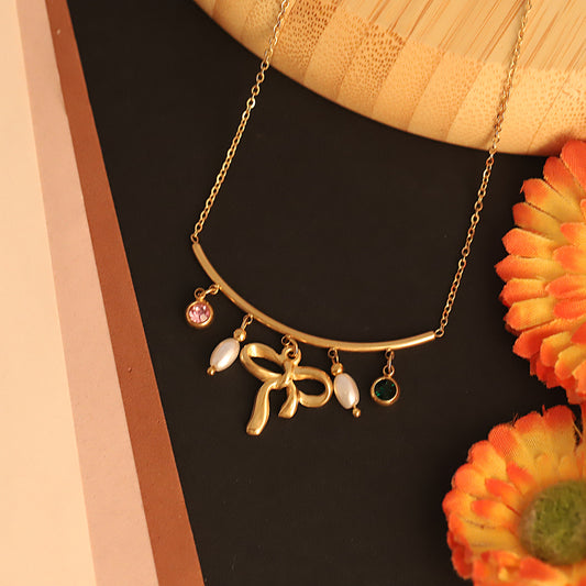 Gilded Grace Charm Necklace – Bow & Gemstone Dangle Design - ZIPPORY