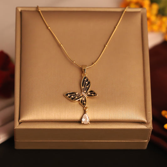 Twilight Wings Pendant Necklace – Black & Gold Butterfly with Teardrop Crystal - ZIPPORY