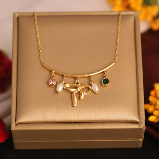 Gilded Grace Charm Necklace – Bow & Gemstone Dangle Design - ZIPPORY