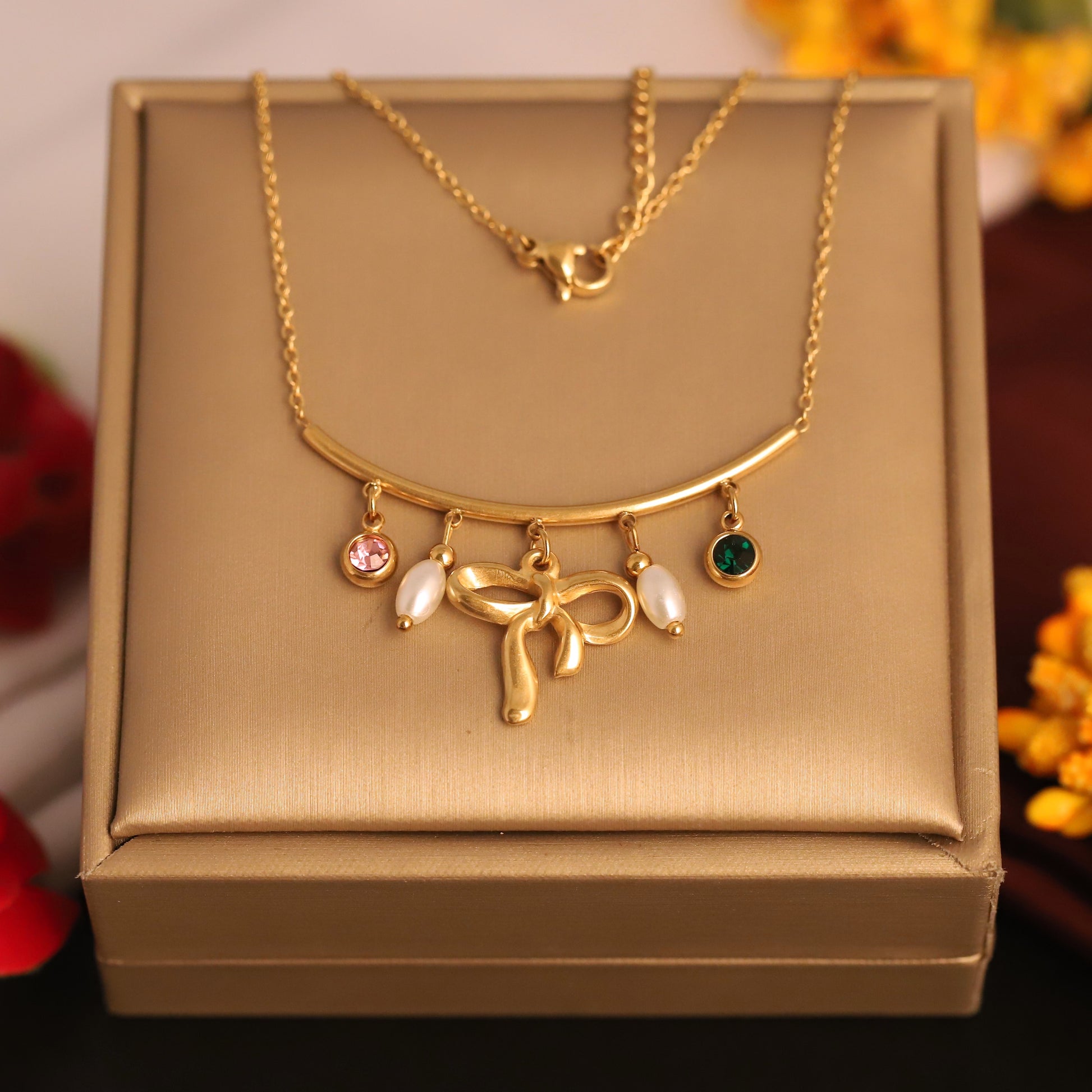 Gilded Grace Charm Necklace – Bow & Gemstone Dangle Design - ZIPPORY